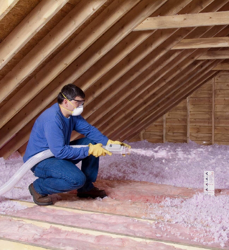 Contractor-Blowing-Insulation-in-an-unfinished-attic-1